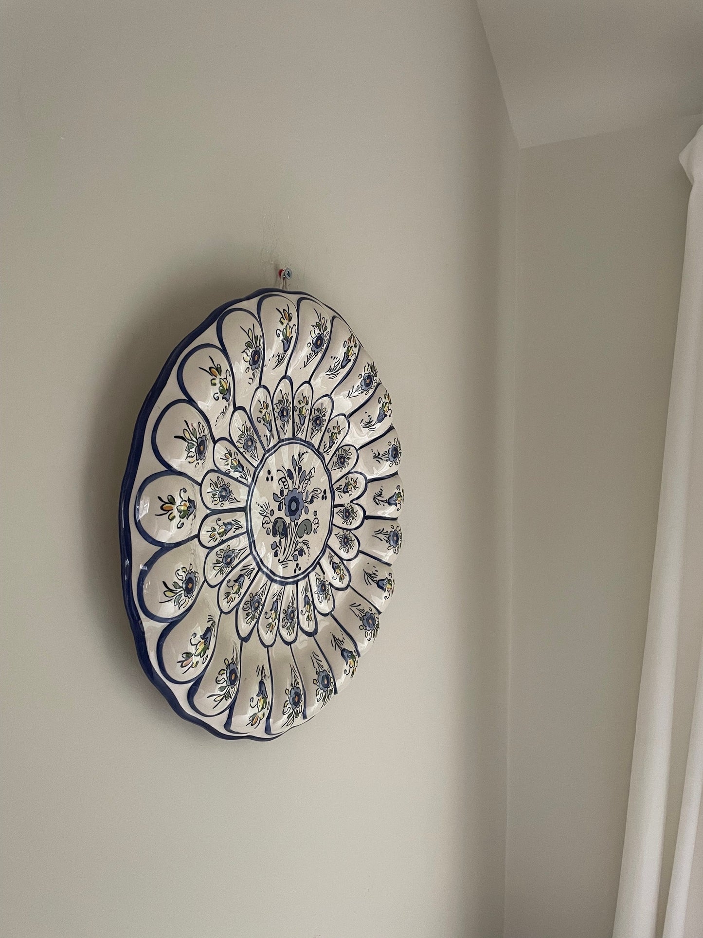 Vintage hand painted white wall hanging plate with blue floral details