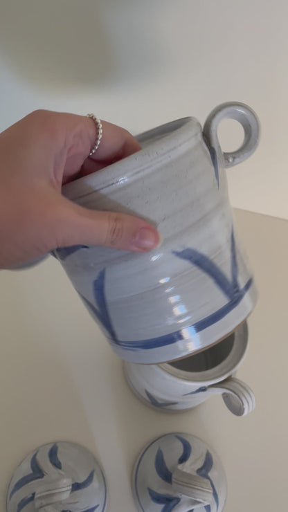 Pair of ceramic handmade canisters in blue and white